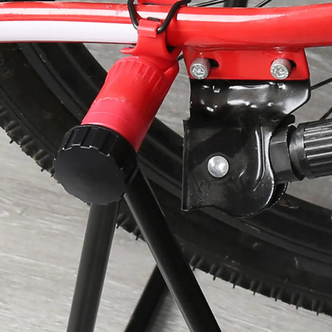 Close-up of a red bike wheel on the Garage Ready Vertical Triangle Bike Stand For Indoor Parking And Maintenance