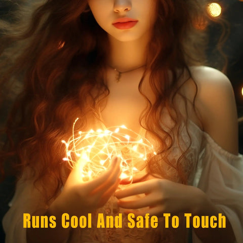 Woman holding 20 LED fairy lights on 6.5ft silver wire battery powered with timer, warm white glow, safe to touch.