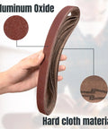 Top Shelf 1X30 Sanding Belts 10 Pack 80 Grit Aluminum Oxide Open Coat X Weight Cloth Backing shown in hand with material details.