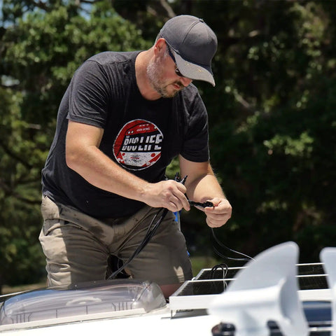 Man installing Solar Y Branch Connectors For Panels 1 To 3 Parallel Cable Kit on RV roof for solar system setup