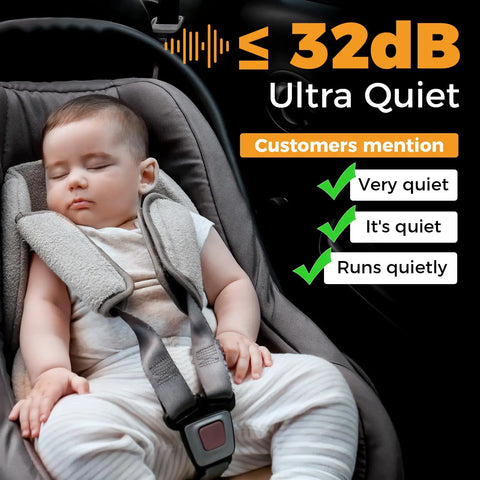 Sleeping baby in a grey car seat with ultra quiet feature < 32dB, showcasing comfort and safety while traveling.