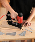 Premium 18 Gauge Brad Nails In 2 Inch One Quarter And Three Quarters Lengths used in a nail gun for woodworking projects.