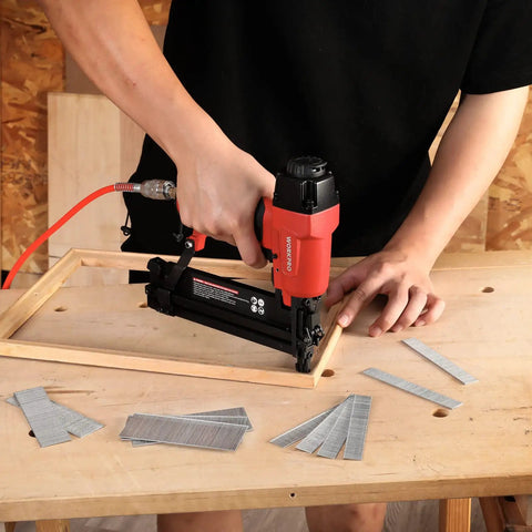 Premium 18 Gauge Brad Nails In 2 Inch One Quarter And Three Quarters Lengths used in a nail gun for woodworking projects.