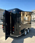 Slick 12 Foot Black Stainless Steel Commercial Food Trailer Equipped With Turnkey Mobile Beer Bar Station And Tough Catering Gear For A No Fuss Pop Up Hustle exterior view with open serving window.