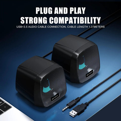 2.0 Stereo USB Powered Desktop Speakers With 3.5mm AUX In Line Volume Control And LED Lights shown on a blue surface