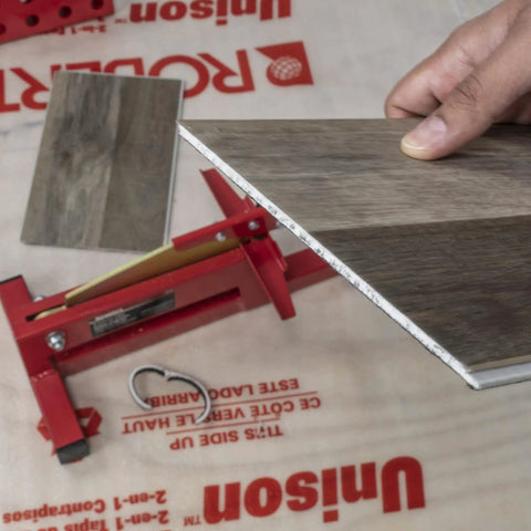 DIY Ready Laminate And Vinyl Plank Cutter For 8 Inch Boards in use cutting laminate, featuring zinc-plated steel blade for clean cuts.