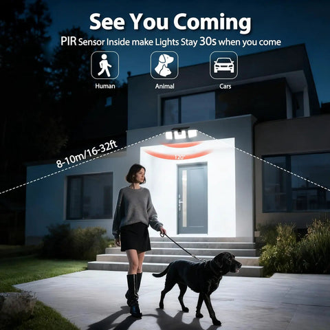 Woman walking dog in front of house at night under activated Beefy Three Head Solar Motion Sensor Flood Light Outdoor Waterproof 3000 Lumen 156 LED Security Spotlight For Patio Garage Yard Entryways Solar Powered 2 Pack Black