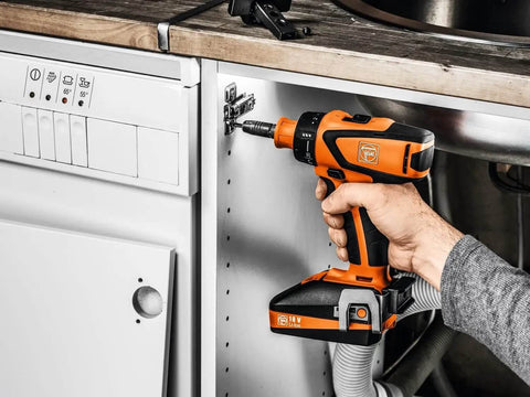 Battle Ready Heavy Duty Cordless Drill Driver Featuring Four Speed Rugged Metal Gearbox Brushless Motor Maximum Torque Output For Wood Metal Plastic Projects in use for fastening.