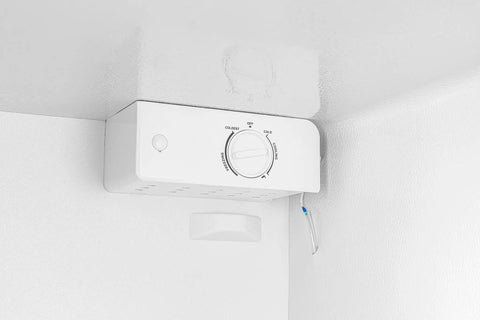 Temperature dial and controls of the 7 Cu Ft Upright Convertible Refrigerator And Freezer With Manual Defrost And Garage Ready Build In Brushed Stainless Steel.