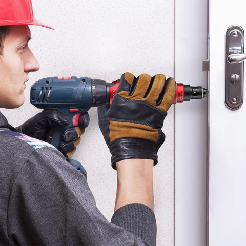 Person using Cordless Rivet Gun Adapter Kit For Drills Electric Rivet Drill Adapter on door metal frame