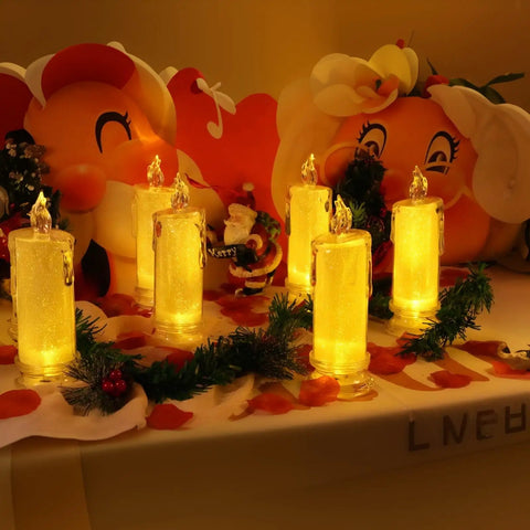 Set Of 4 White LED Flameless Pillar Candles, 2.5 Inch Diameter By 7 Inch Tall, Battery Operated, Realistic Flicker, Safe Faux Candles For Valentine Wedding Ramadan Christmas Decor placed on decorative shelf with festive ornaments.