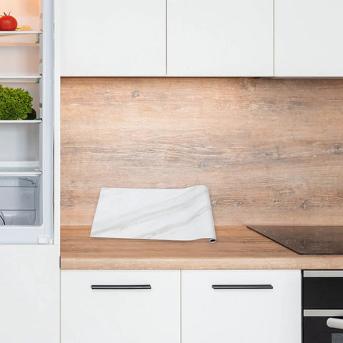 Waterproof Peel And Stick Wallpaper With True Marble Grain For Kitchen Backsplash And Cabinet Makeover Quick Install on wooden countertop.