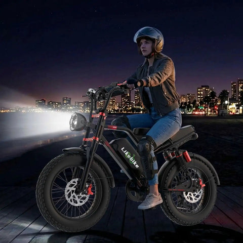 Premium Adult Electric Bike With A Badass 3000W Peak Brushless Hub Motor, Packing A Massive 48V 33Ah Removable Battery For Tough Trail Ripping And Smooth Pavement Cruisin at night on a boardwalk.