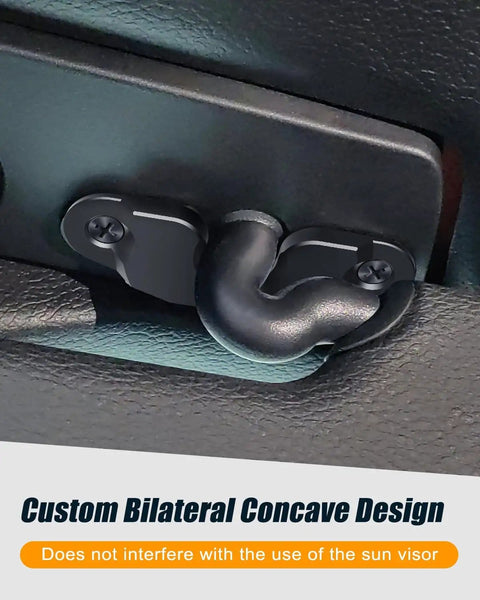 Close-up of Beefed Up Aluminum Sun Visor Repair Kit installed in Jeep Wrangler, showing heavy-duty visor clip design