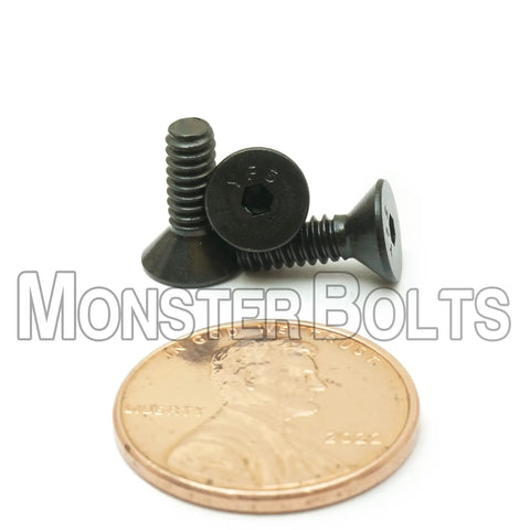 Tough As Nails Number Six By Thirty Two Thread Flat Head Socket Cap Screw Seven Sixteenths Inch Alloy Steel with penny for size comparison.