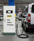 Outdoor Industrial-Grade 80kW DC Fast Charger With CCS1 next to van in parking lot, floor-standing unit with cable attached