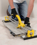 Using 24 Inch Manual Tile Cutter With Tungsten Carbide Scoring Wheel For Porcelain And Ceramic Tiles on floor
