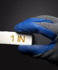 Ceramic fiber insulation board, white, 1 in thick, rough texture, held by a gloved hand (close-up).