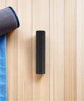 Ergonomic Lifting Handle Covers For Dumbbells And Barbells Non Slip Plastic Grips on wooden floor with fitness mat