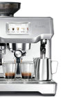 Heavy Duty Fully Automatic Espresso Machine With Slick Touchscreen Interface And Pro Grade Dual Boiler Rig For Killer Specialty Coffee At Home Featuring Precise Thermal Regulation And Smooth Simultaneous Brewing with dual glass cups and milk frother.