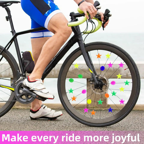 Cyclist on bike with Colorful Bike Wheel Spoke Beads Set With Round And Star Shapes, 72 Pieces With Plastic Storage Box Included