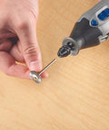 Close-up of a hand holding a polishing bit and fitting it into the Drop Dead Easy Multi Chuck For Rotary Tools.
