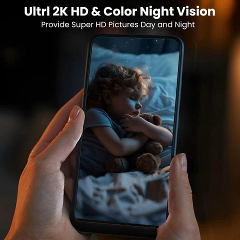 Person holding a smartphone displaying Ul2K HD & Color Night Vision, showcasing a child sleeping with a teddy bear.