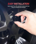 Close-up of hand installing Tesla No Logo Wheel Center Caps Kit for Model Y and Model 3, easy installation on 19 or 20 inch wheels.