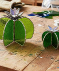 Next Level Stained Glass Soldering Jig With 3D Cactus Mold Template For Zero Stress Copper Foiling and Rock Hard Tweezers Plus Slick Petg Base featuring two completed cactus shapes in green stained glass.