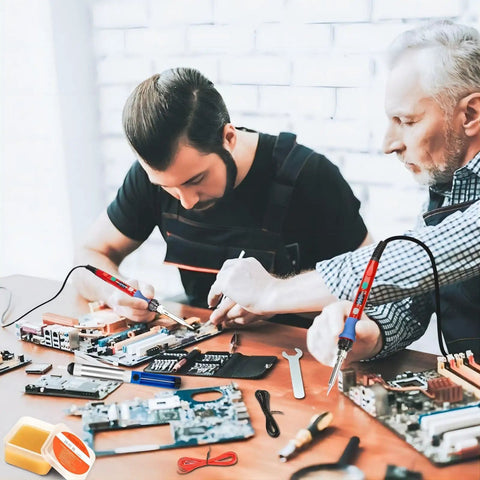 Two men using Pro Grade Fast Heating 90W Soldering Iron Kit With LED Digital Display 110V Ceramic Heater for electronics repair