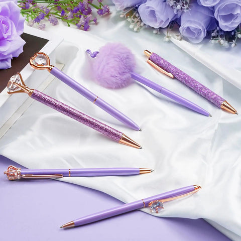 Purple Crystal Diamond Pens Set 8 Metal Pens In Different Styles With Black And Blue Ink For Journaling And Office Use For Women Glam Back To School Essentials And Girl Birthday Gift Idea on white fabric with purple flowers.