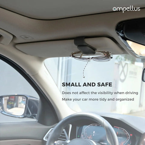 Keep Your Dash Clean With This Beefy Magnetic Leather Sunglass Holder Snapping Tight On Visors Grabbing Shades Cards And Cash Secure So Your Ride Stays Fresh Forever mounted on car visor, holding sunglasses neatly.