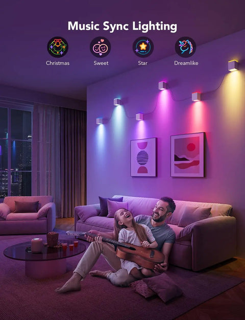 Modern Cube Wall Sconces With Adjustable Cable Distance And Smart RGBic LED Fixture That Hooks Up To Alexa For Chill Living Room Vibes, colorful lighting in a cozy living space with family.