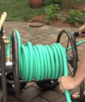 Heavy Duty Four Wheel Hose Reel Cart With 250 Foot Capacity, Steel Frame, Built In Garden Basket, Brown Bronze Finish used outdoors