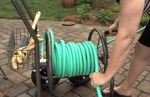 Heavy Duty Four Wheel Hose Reel Cart With 250 Foot Capacity, Steel Frame, Built In Garden Basket, Brown Bronze Finish used outdoors