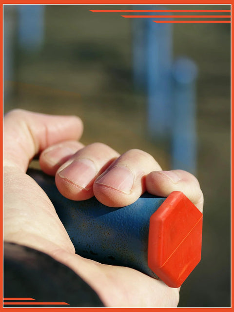 Close-up of hand holding a large orange and blue rubber hydraulic oil service plug from 42 Piece Hydraulic Oil Service Plugs Set In Large Medium Small Sizes Made Of Durable Rubber For Oil Pipes And Hoses Universal Fit For Hydraulic Systems And Irrigation Reusable Leakproof Seals.