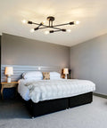 Six Light Vintage Sputnik Chandelier In Matte Black Metal Semi Flush Mount Ceiling Light Fixture For Dining Room Living Room And Bedroom Industrial Farmhouse Style With Modern Cozy Vibe above a bed