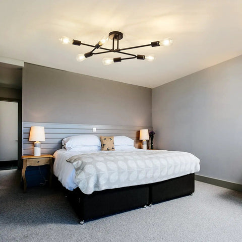 Six Light Vintage Sputnik Chandelier In Matte Black Metal Semi Flush Mount Ceiling Light Fixture For Dining Room Living Room And Bedroom Industrial Farmhouse Style With Modern Cozy Vibe above a bed