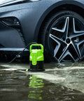 Three-Quarter HP Submersible Sump Pump beside a car, green 3/4 HP model for drainage and water removal, 20 ft cord in use.