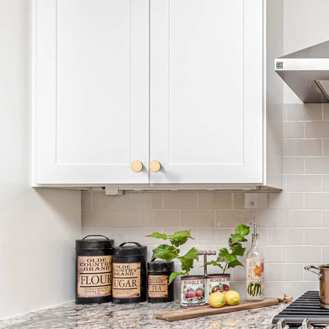 Kitchen with white cabinets featuring 10 Pack Brushed Brass Cabinet Knobs 1-1/4 Inch Gold Drawer Knobs for Kitchen Cabinets and Dressers.