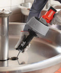 K-45AF Air Powered Drain Cleaner 230V Drum Auger in use over a sink, designed for sewer pipes and clogs.
