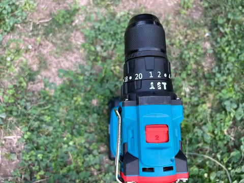 Top view of Badass 21V Rechargeable Cordless Drill Kit with 10mm Keyless Chuck, highlighting speed settings and color.