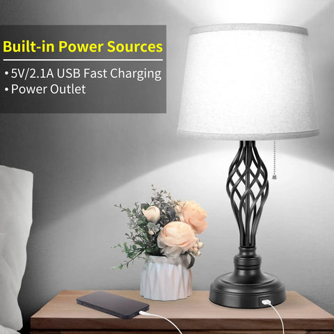 Set Of 2 Bedside Lamps With USB Port And AC Outlet in living room, 22-inch tall, gray shade, lit with pull chain visible.