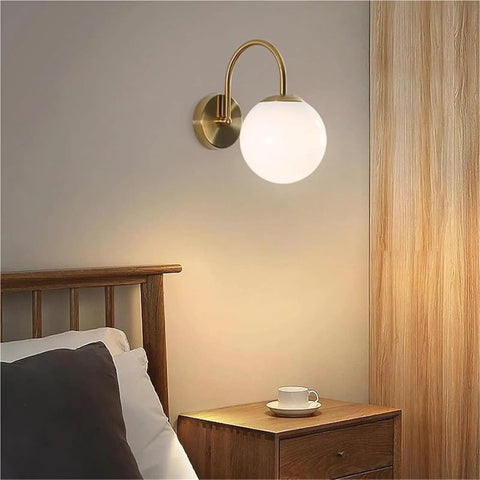 Gold Wall Sconce Mid Century Modern Wall Mount Light Hardwired Sconces Wall Light with Milky White Glass Shade indoor bedside lamp over bed.