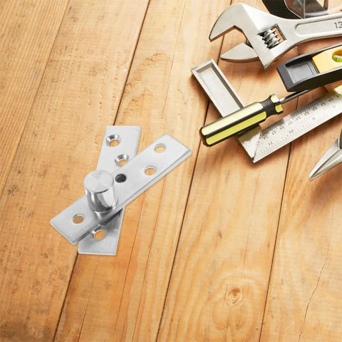 Close-up of Built To Last Stainless Pivot Door Hinges 2 Pack Concealed Offset Hinges with tools on wooden surface