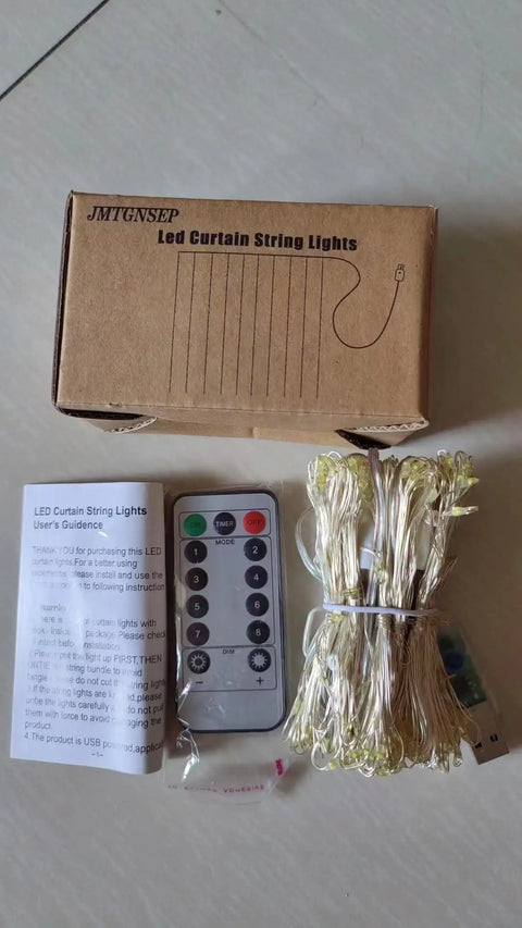 Box displaying LED curtain lights with remote, USB connector, and manual; Multicolor USB Curtain Lights With Eight Modes For Indoor And Outdoor Decor.