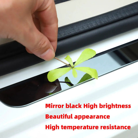 Badass Level Stainless Steel Door Sill Scuff Plate Guards For Rivian R1S R1T R2, mirror black finish with a leaf showcased.