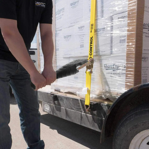 Heavy Duty Ratchet Strap Tightening Handle for 2 Inch 3 Inch and 4 Inch Straps Black Polycarbonate Grip in use on trailer