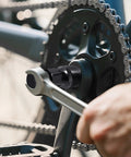 Heavy Duty Bike Crank Puller Tool For Square Taper And Splined Cranks Pro Grade Crank Removal Tool in use on bicycle