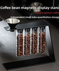 Glass Coffee Bean Storage Tubes Set Of Six With One Way Degassing Valve And Magnetic Stand And Single Dose Espresso Dosing Vials on display.